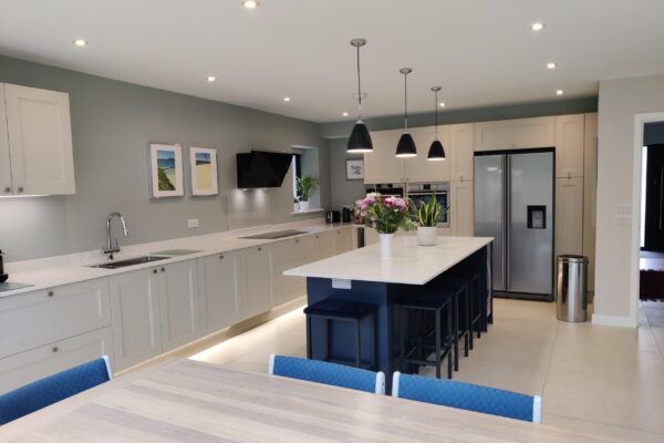 white kitchen with blue island